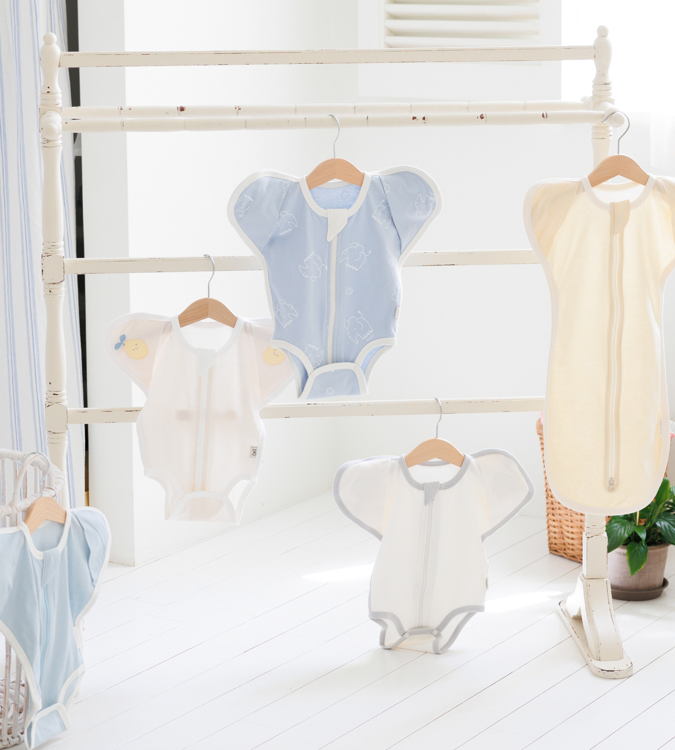 MEY newborn gowns on a clothing rack