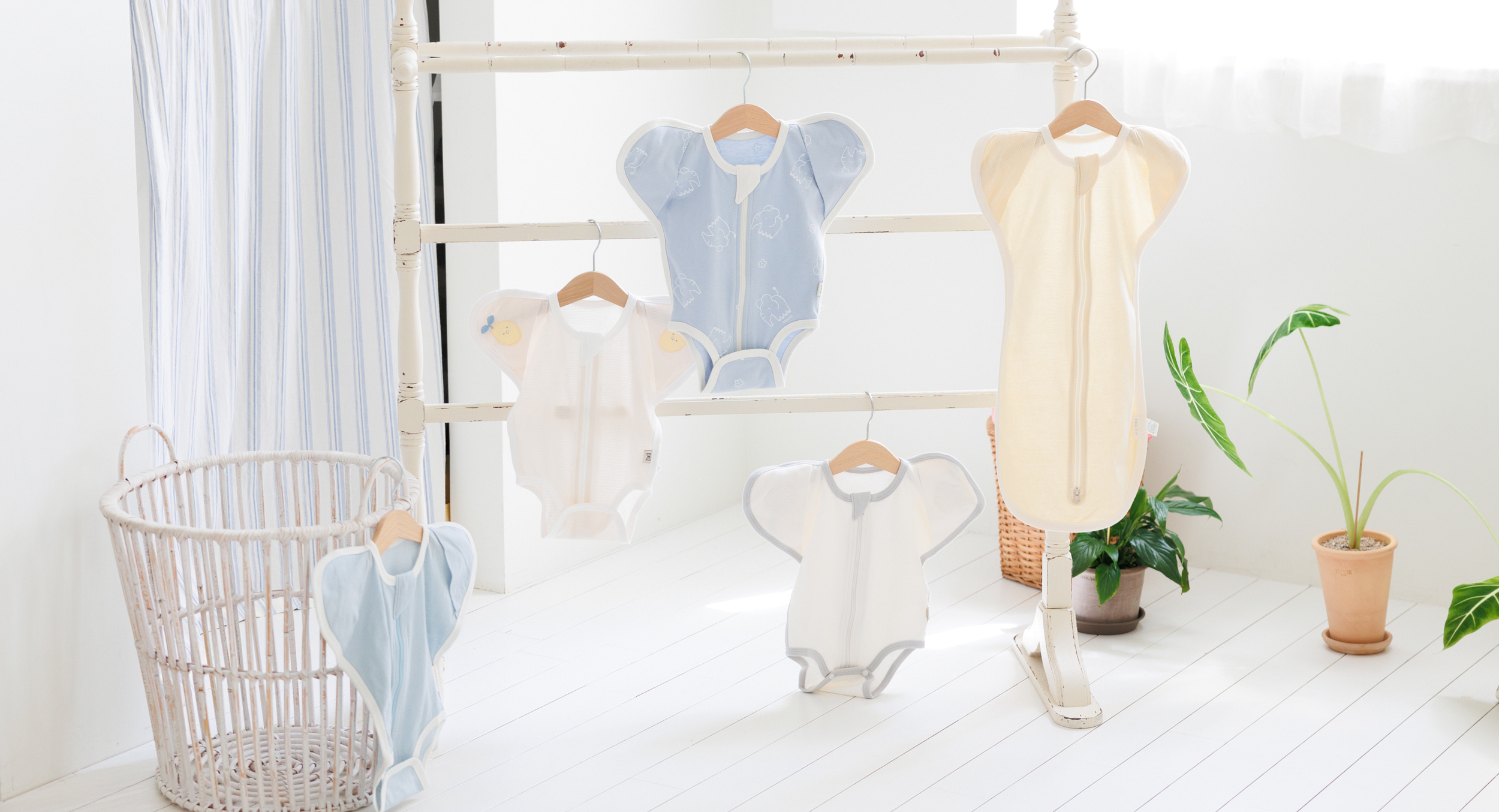 MEY newborn gowns on a clothing rack