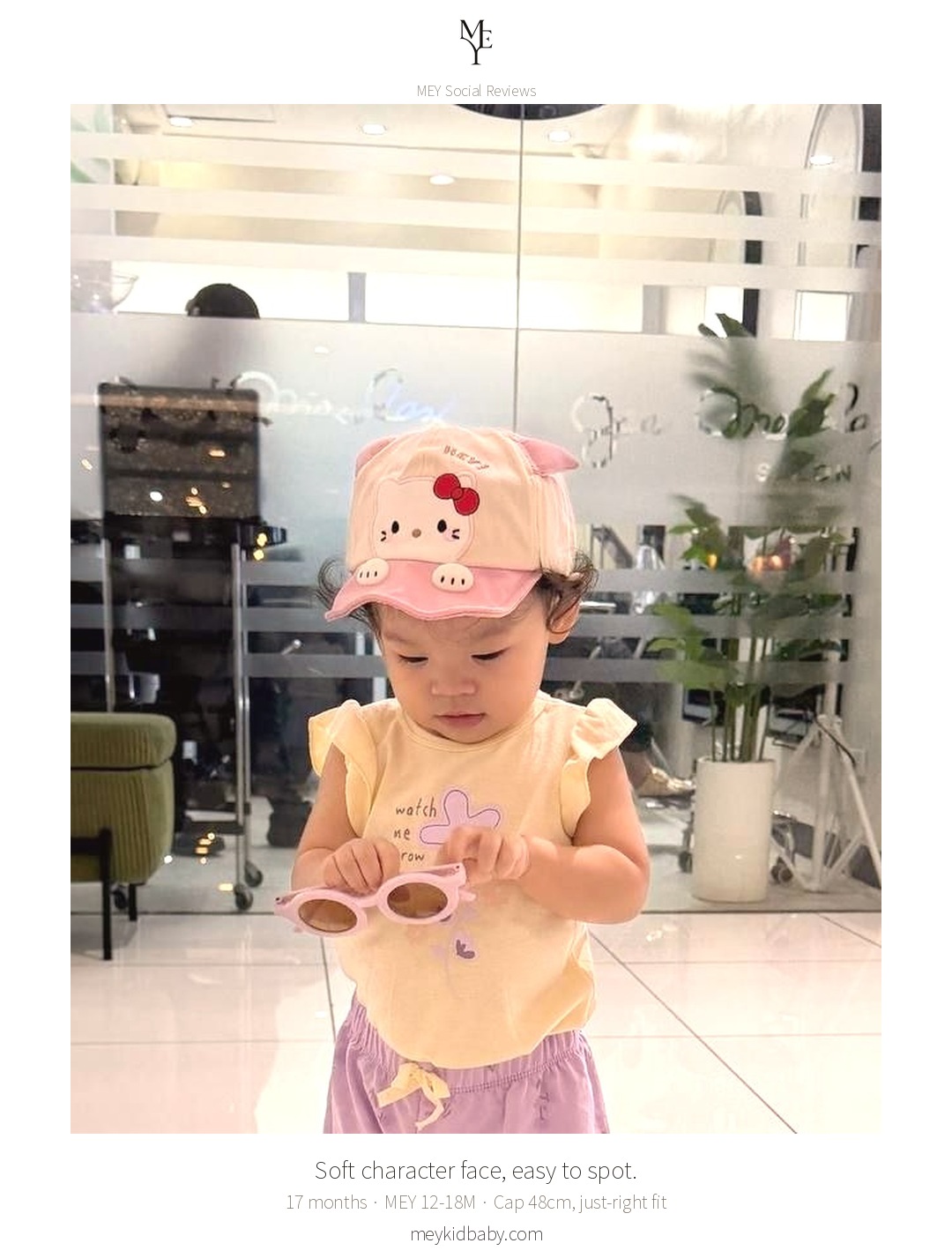 A 17-month-old wearing the MEY character cap during a mall afternoon 3